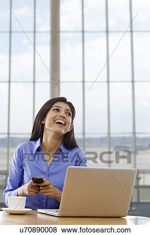 Woman with a mobile phone View Large Photo Image Stock Photo - Woman with a mobile phone . Fotosearch