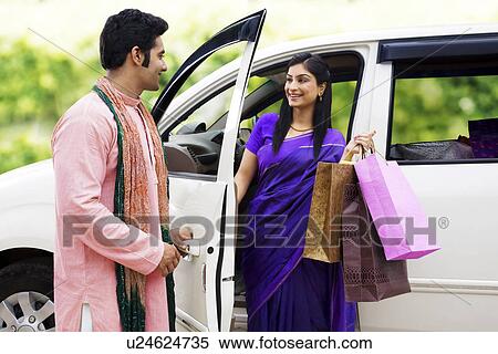 Stock Photography - Woman with shopping bags . Fotosearch