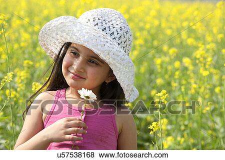 Young girl with a flower View Large Photo Image Stock Photo - Young girl with a flower . Fotosearch