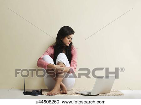 Young girl with a laptop View Large Photo Image Stock Image - Young girl with a laptop . Fotosearch