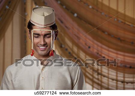 Young Indian groom smiling View Large Photo Image Picture - Young Indian groom smiling . Fotosearch