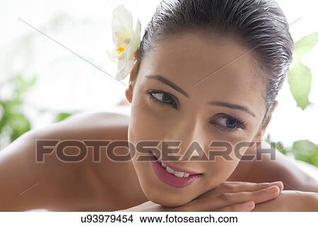 Picture - Young woman at spa looking away . Fotosearch