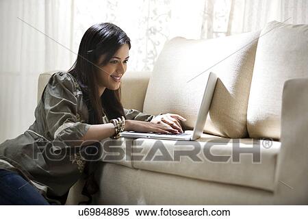 Young woman chatting on the internet View Large Photo Image Stock Photography - Young woman chatting on the internet . Fotosearch