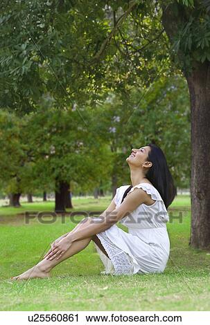 Stock Image - Young woman enjoying nature . Fotosearch