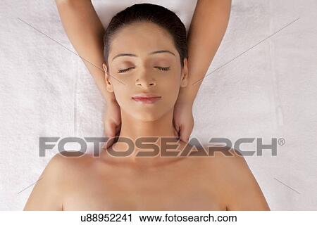 Young woman having neck massage View Large Photo Image Stock Image - Young woman having neck massage . Fotosearch