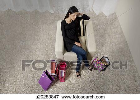 Young woman taking a nap on her sofa View Large Photo Image Stock Photo - Young woman taking a nap on her sofa . Fotosearch