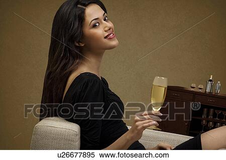 Stock Photography - Young woman with a glass of wine . Fotosearch