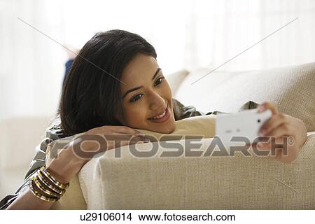 Young woman with a mobile phone View Large Photo Image Picture - Young woman with a mobile phone . Fotosearch