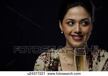 Young woman with a wine glass View Large Photo Image Stock Image - Young woman with a wine glass . Fotosearch