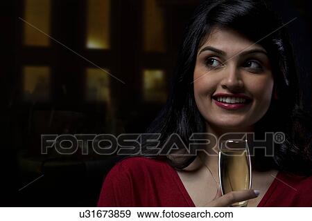 Young woman with a wine glass View Large Photo Image Stock Photo - Young woman with a wine glass . Fotosearch