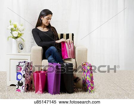Young woman with shopping bags View Large Photo Image Stock Photography - Young woman with shopping bags . Fotosearch