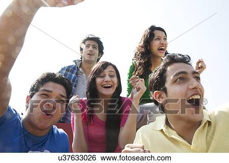 Youngsters cheering View Large Photo Image Stock Photograph - Youngsters cheering . Fotosearch