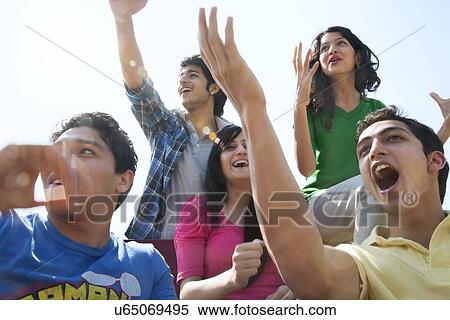 Youngsters cheering View Large Photo Image Stock Photography - Youngsters cheering . Fotosearch