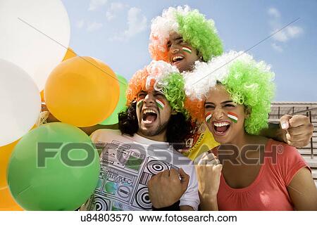 Youngsters with wigs cheering View Large Photo Image Stock Image - Youngsters with wigs cheering . Fotosearch
