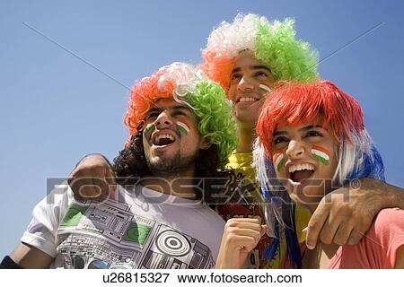 Youngsters with wigs cheering View Large Photo Image Stock Photo - Youngsters with wigs cheering . Fotosearch
