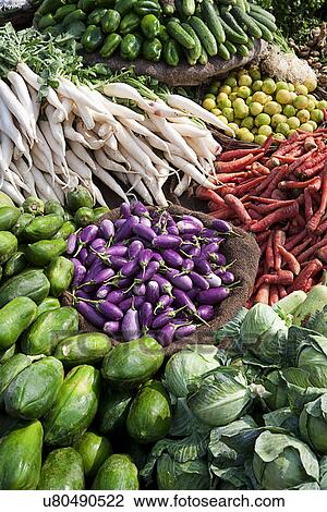 Stock Image - A street market stall selling vegetables. Fotosearch