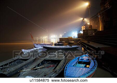Stock Photography - Boats moored on the ghats . Fotosearch