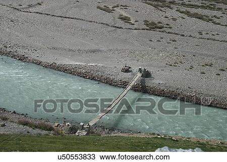 Stock Image - Bridge across a river . Fotosearch