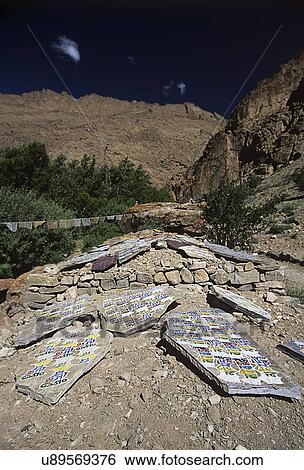 Buddhist mantras on stone View Large Photo Image Stock Photograph - Buddhist mantras on stone. Fotosearch