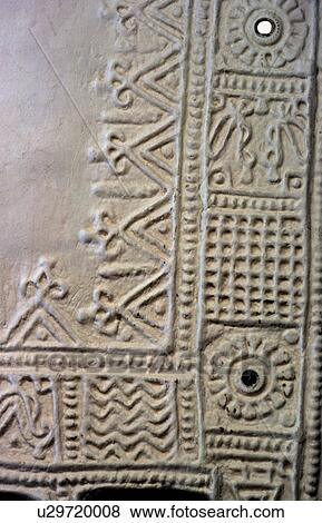 Stock Photo - Geometric pattern on mud wall. Fotosearch