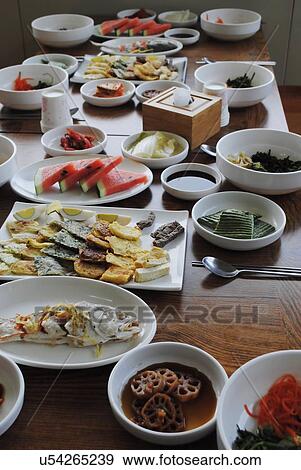 Stock Photo - Korean food spread out on a table . Fotosearch