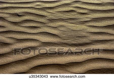 Stock Image - Patterns on sand. Fotosearch