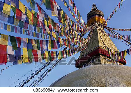 Stock Photo - Prayer flags hanging on the Great Stupa . Fotosearch