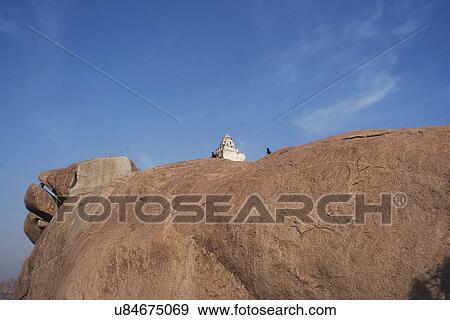 Shiva shrine on a boulder at Malyavanta Hill  View Large Photo Image Stock Photo - Shiva shrine on a boulder at Malyavanta Hill . Fotosearch