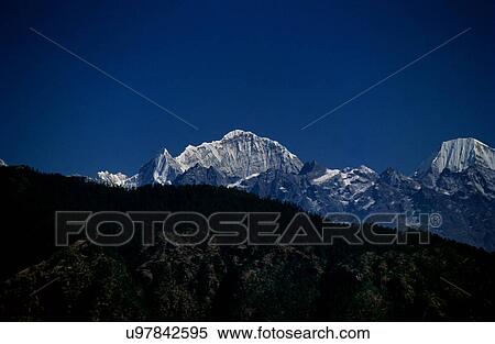 Snow capped mountains View Large Photo Image Stock Photography - Snow capped mountains. Fotosearch