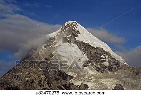 Stock Photography - Snow clad mountain peak. Fotosearch