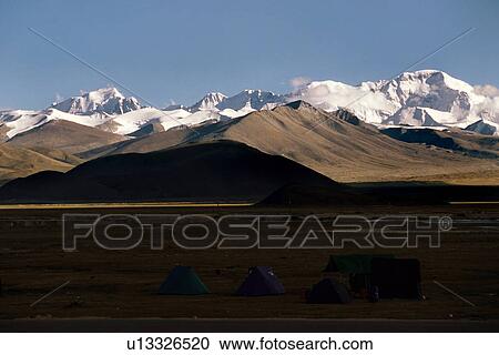 Stock Image - Snow clad mountain peaks. Fotosearch