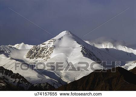 Snow covered mountain View Large Photo Image Stock Photography - Snow covered mountain. Fotosearch