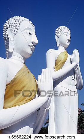 Statues of Buddha praying View Large Photo Image Picture - Statues of Buddha praying. Fotosearch