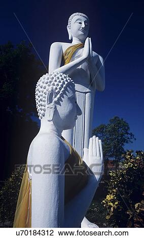 Statues of Buddha praying View Large Photo Image Stock Image - Statues of Buddha praying. Fotosearch