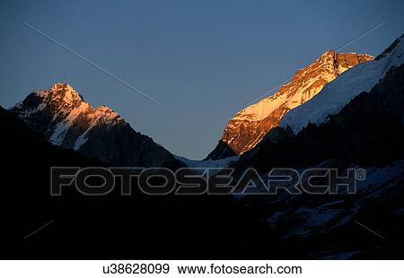 Sunlight on the mountain peaks View Large Photo Image Stock Photo - Sunlight on the mountain peaks. Fotosearch