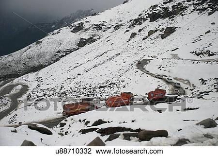 Trucks driving through Rohtang Pass View Large Photo Image Stock Image - Trucks driving through Rohtang Pass . Fotosearch
