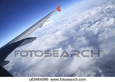 Wing of a plane View Large Photo Image Stock Photograph - Wing of a plane. Fotosearch