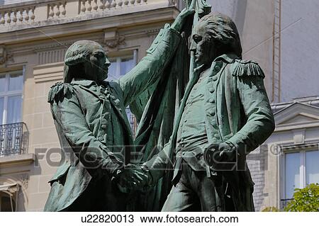 Stock Image - A statue honors French military officer Marquis Lafayette and first president of the United States George Washington on the United States square in the 16th district of Paris.. Fotosearch