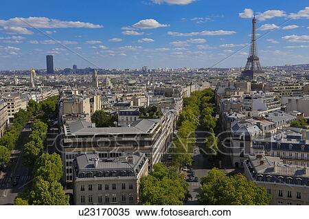 Aerial view of Paris, France as seen from the Arch of Triumph on a sunny day with white puffy clouds and the Eifel Tower View Large Photo Image Stock Photography - Aerial view of Paris, France as seen from the Arch of Triumph on a sunny day with white puffy clouds and the Eifel Tower. Fotosearch