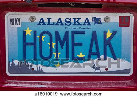 Stock Photo - Alaska Vanity License plate says "HOMEAK" - meaning home in Alaska. Fotosearch