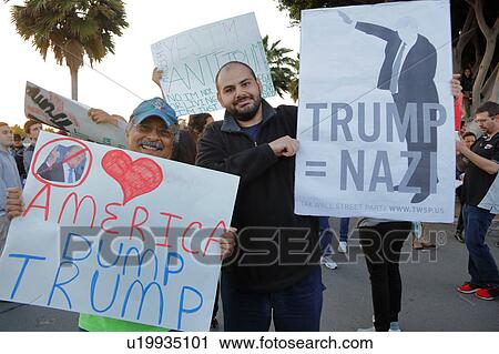 Stock Image - Anti-Trump protestor at the Pacific Amphitheater in Costa Mesa, California. Fotosearch
