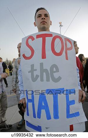 Stock Image - Anti-Trump protestor at the Pacific Amphitheater in Costa Mesa, California. Fotosearch