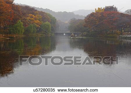 Stock Photography - Autumn color ond pond at Namsangol traditional folk village, Seoul, South Korea. Fotosearch