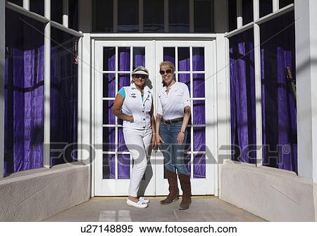 Bisbee, Arizona, USA, April 6, 2015, Phylis Tampio and Leslie Plimpton pose in front of purple draped doorway View Large Photo Image Stock Photography - Bisbee, Arizona, USA, April 6, 2015, Phylis Tampio and Leslie Plimpton pose in front of purple draped doorway. Fotosearch