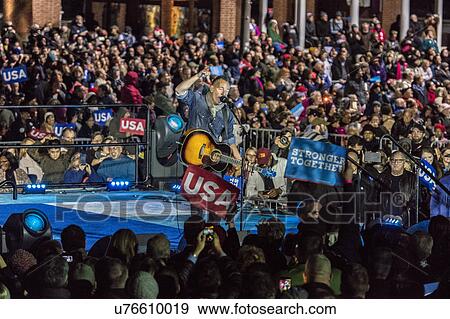 Stock Photo - Bruce Springstein performs for Hillary Clinton Holds Election Eve Get Out the Vote Rally With Jon Bon Jovi and President and Michelle Obama, Bill and Chelsea Clinton. . Fotosearch