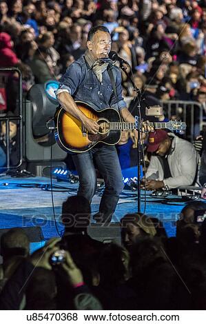 Stock Photo - Bruce Springstein performs for Hillary Clinton Holds Election Eve Get Out the Vote Rally With Jon Bon Jovi and President and Michelle Obama, Bill and Chelsea Clinton. . Fotosearch