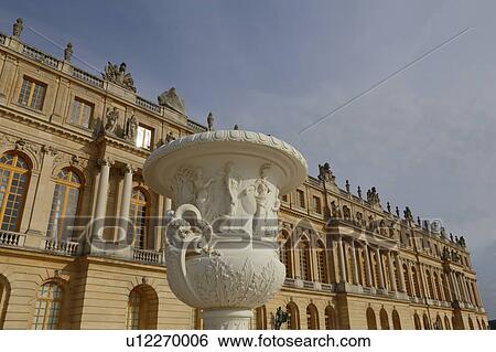 Stock Photograph -  Chateau de Versailles and Vase at the estate of Versaille was the home and court of Louis XIV, France. Fotosearch