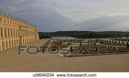 Picture -  Chateau de Versailles at sunset with fountain, the estate of Versaille was the home and court of Louis XIV, France. Fotosearch