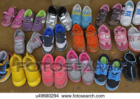 Picture - Childrens shoes removed at front door at Namsangol traditional folk village, Seoul, South Korea. Fotosearch