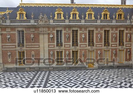 Stock Image - Courtyard of Chateau de Versailles, the estate of Versaille home of Louis XIV, France. Fotosearch